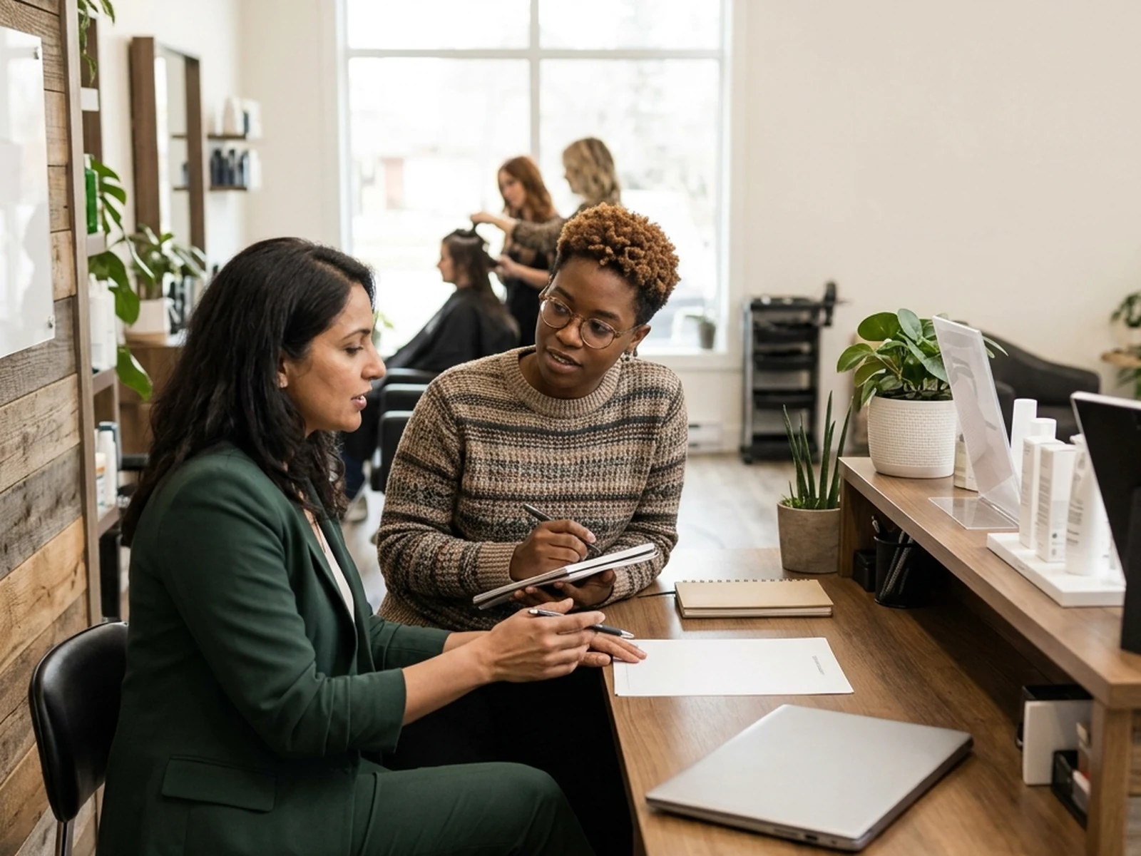 Salon owner discussing advertising options with an advisor